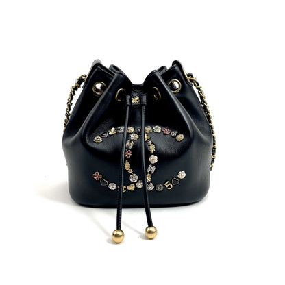 Chanel Logo Charm CC Lambskin Drawstring Bucket Bag - photo 1